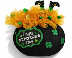 St. Patrick's Day themed black pot with gold mesh, green shamrocks, and 'Happy St. Patrick's Day' sign