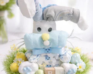 Handmade bunny diaper cake with blue accents, perfect baby shower gift or nursery centerpiece
