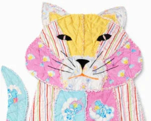 Handmade quilted cat memory keepsake from cherished clothing, soft pastel patchwork design