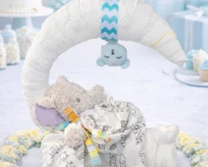 Handmade memory keepsake bear with baby blanket and diaper cake centerpiece