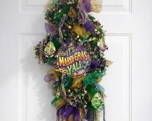Mardi Gras wreath with purple, green, gold beads and 'It's Mardi Gras Y'all' sign, perfect baby shower or festive decor