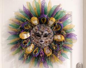 Mardi Gras mask wreath with purple, green, gold tulle and decorative beads, perfect for festive door decor