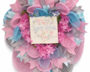 Pink and blue baby shower wreath with 'Super Mom' sign, handmade keepsake for new moms