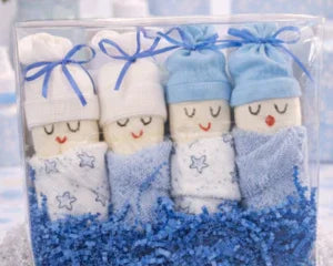 Adorable baby boy diaper cake with blue hats, bows, and star-print blankets"perfect baby shower gift