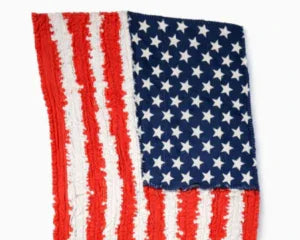 Handmade American flag memory blanket crafted from cherished clothing, perfect for patriotic keepsakes.