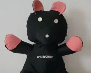 Black memorial keepsake bear with pink ears and paws, personalized with embroidered text