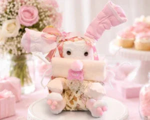 Handmade memory bear crafted from baby clothes, perfect for baby shower gifts or keepsakes
