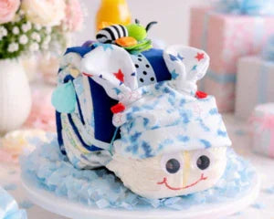 Adorable diaper cake shaped like a train, perfect baby shower gift with soft fabrics and playful details